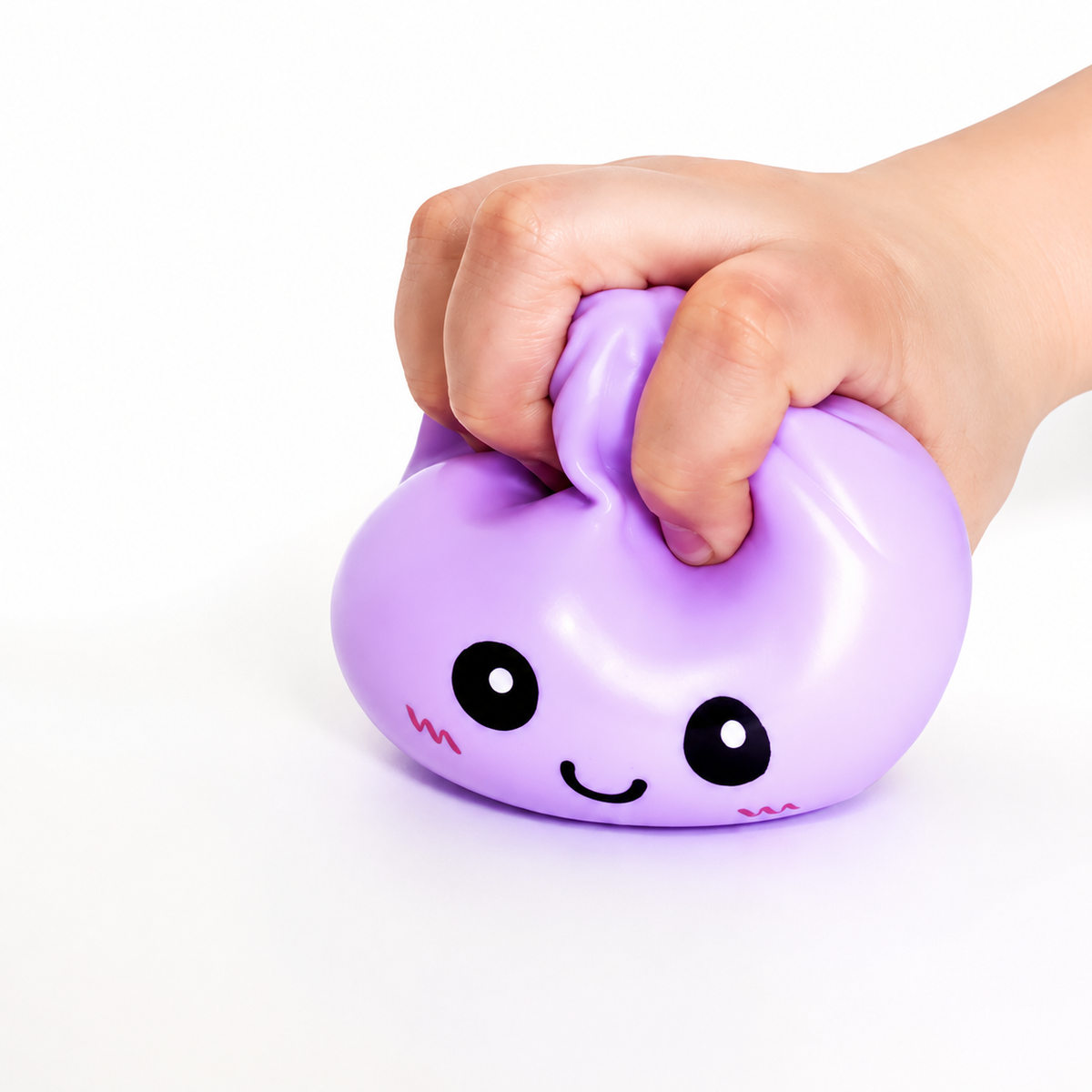 child gripping a purple squishy sensory toy