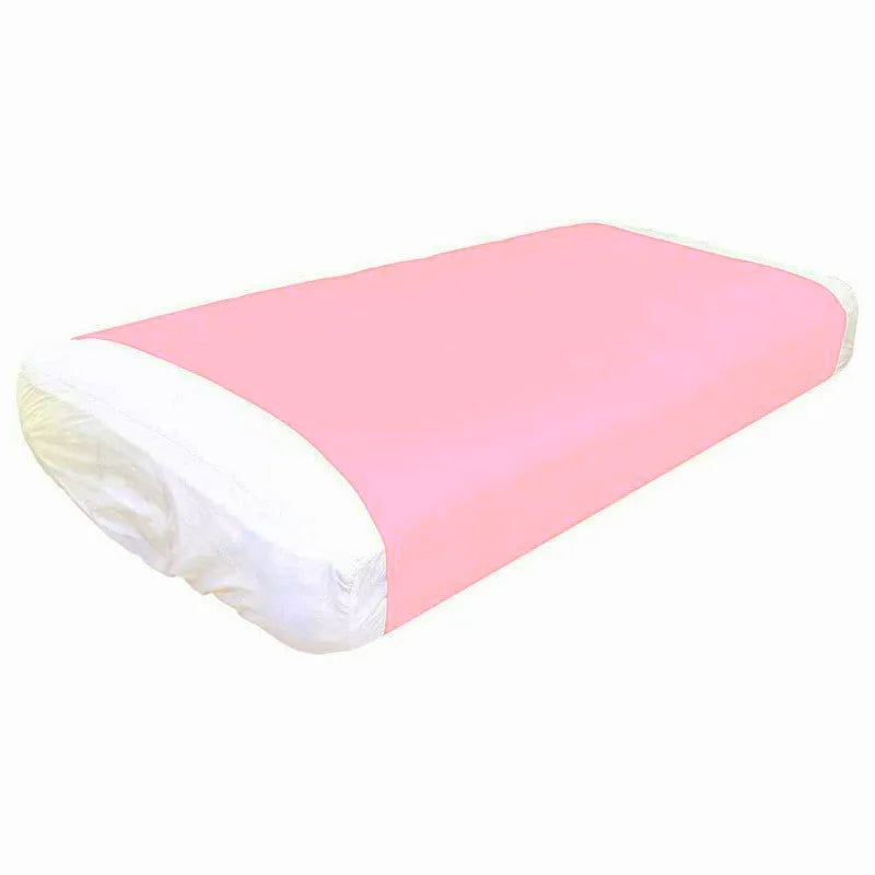 a bed with a fitted pink compression blanket for special needs covering the mattress