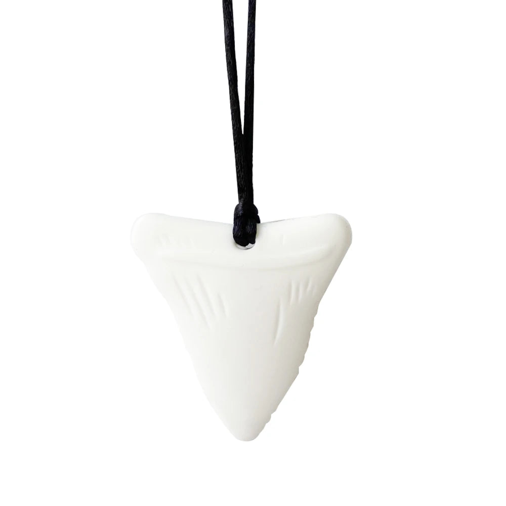 White shark tooth pendant on a black cord against a white background