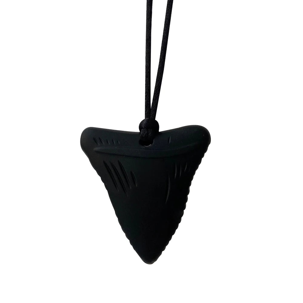Black shark fin-shaped pendant on a white background