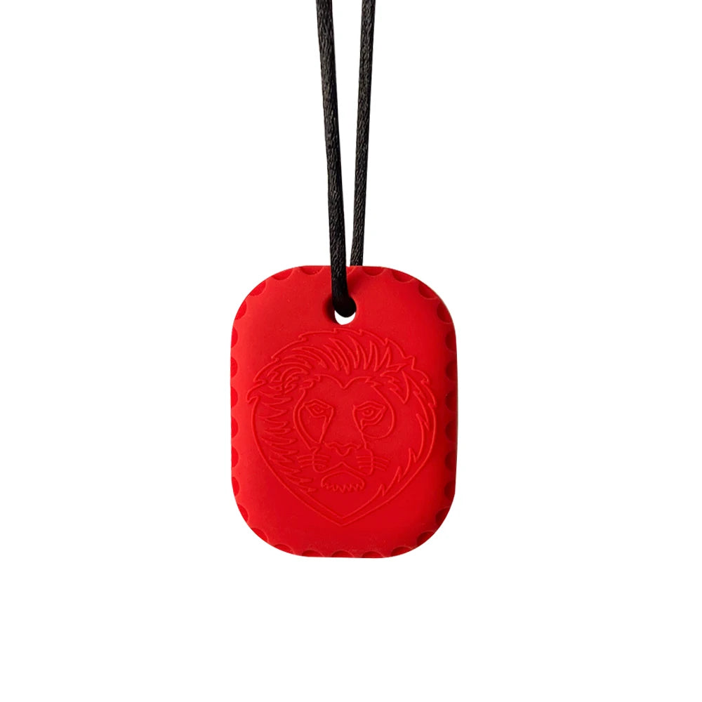 Red pendant with lion emblem on a black cord against a white background