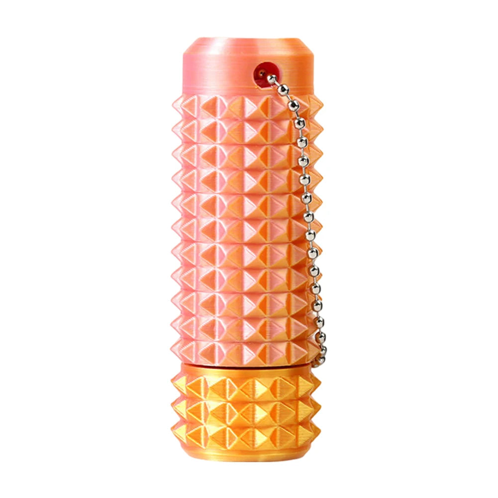 textured acupressure fidget roller with keychain in a color that resembles a sun rise