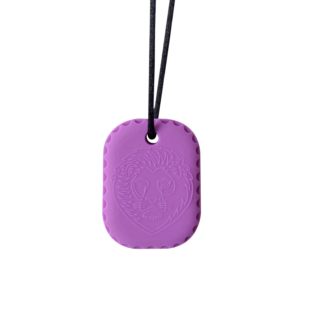 Purple silicone pendant with lion design on a white background
