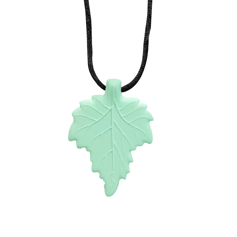Mint green leaf-shaped pendant on a black cord against a white background