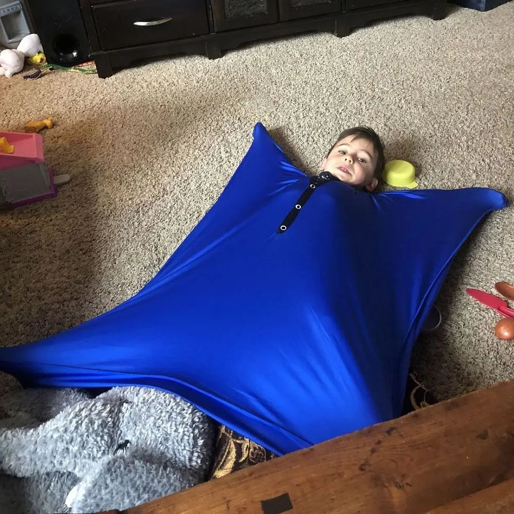 Child enjoying the Sensory Compression Body Sock for Kids, providing calming sensory play and movement.