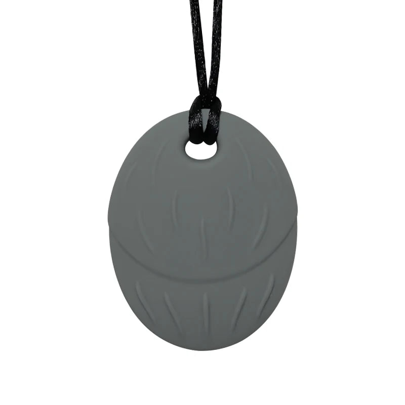 Gray silicone pendant on a black cord against a white background