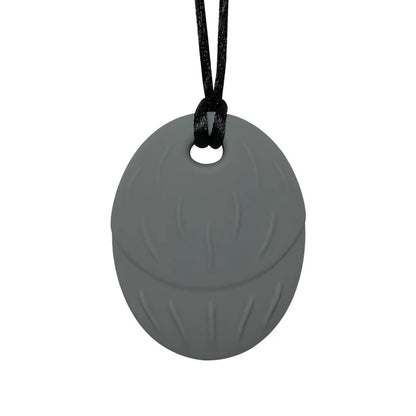 Gray silicone pendant on a black cord against a white background