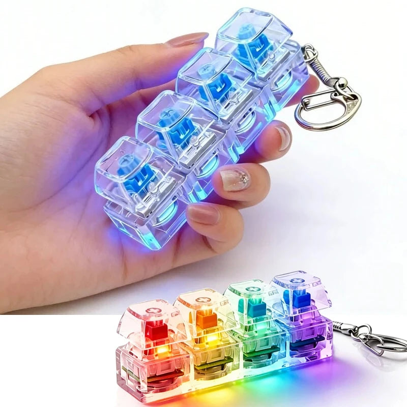 Illuminated mechanical fidget keychain with rainbow LED lights, held in hand