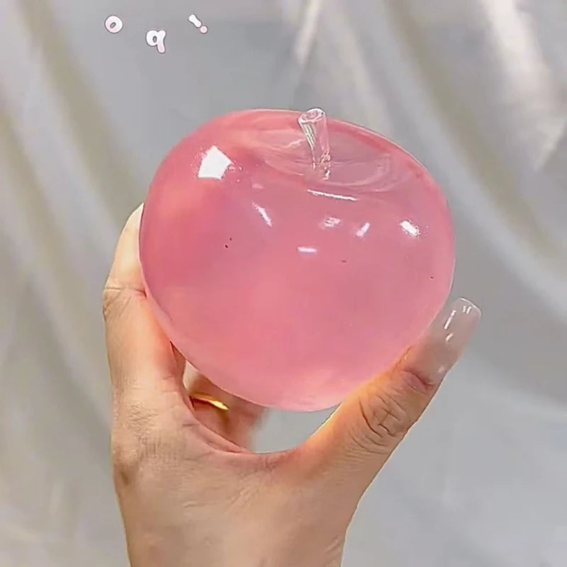 pink apple squeeze toy for stress relief and sensory stimulation front view