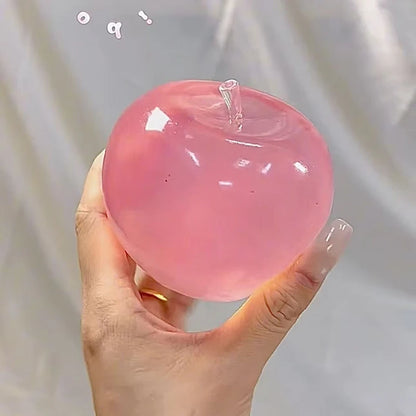 pink apple squeeze toy for stress relief and sensory stimulation front view