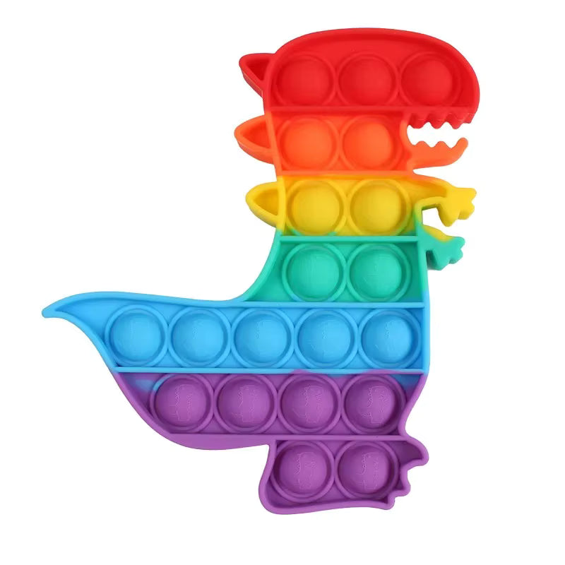 Rainbow Pop-It Fidget Toy — Assorted Shapes in dinosaur design with vibrant rainbow colors, perfect sensory toy for kids and adults in Ireland.