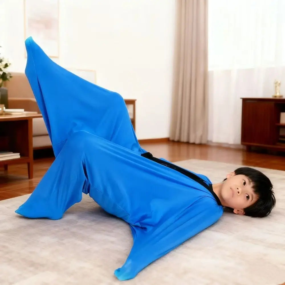 Child demonstrating the Sensory Compression Body Sock for Kids, enjoying active sensory play at home.