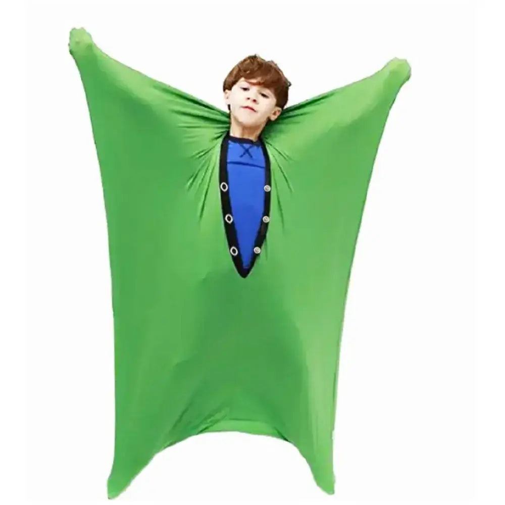 Child enjoying movement in a green Sensory Compression Body Sock for Kids, a fun sensory toy for children in Ireland.